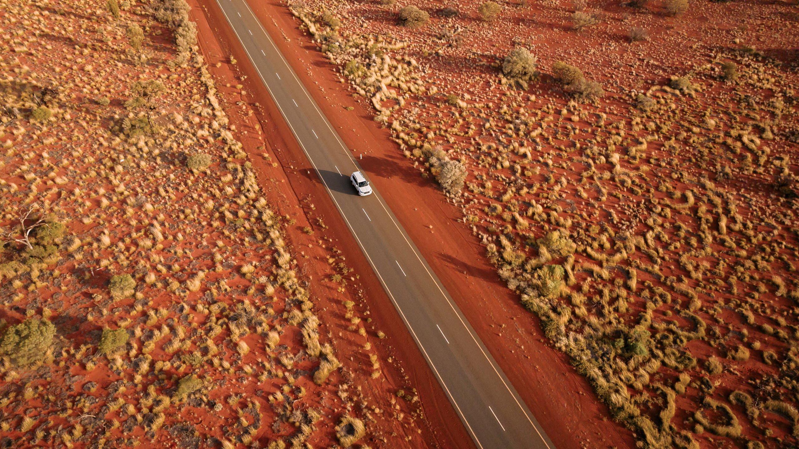 Car driving along a highway in the Australian Outback