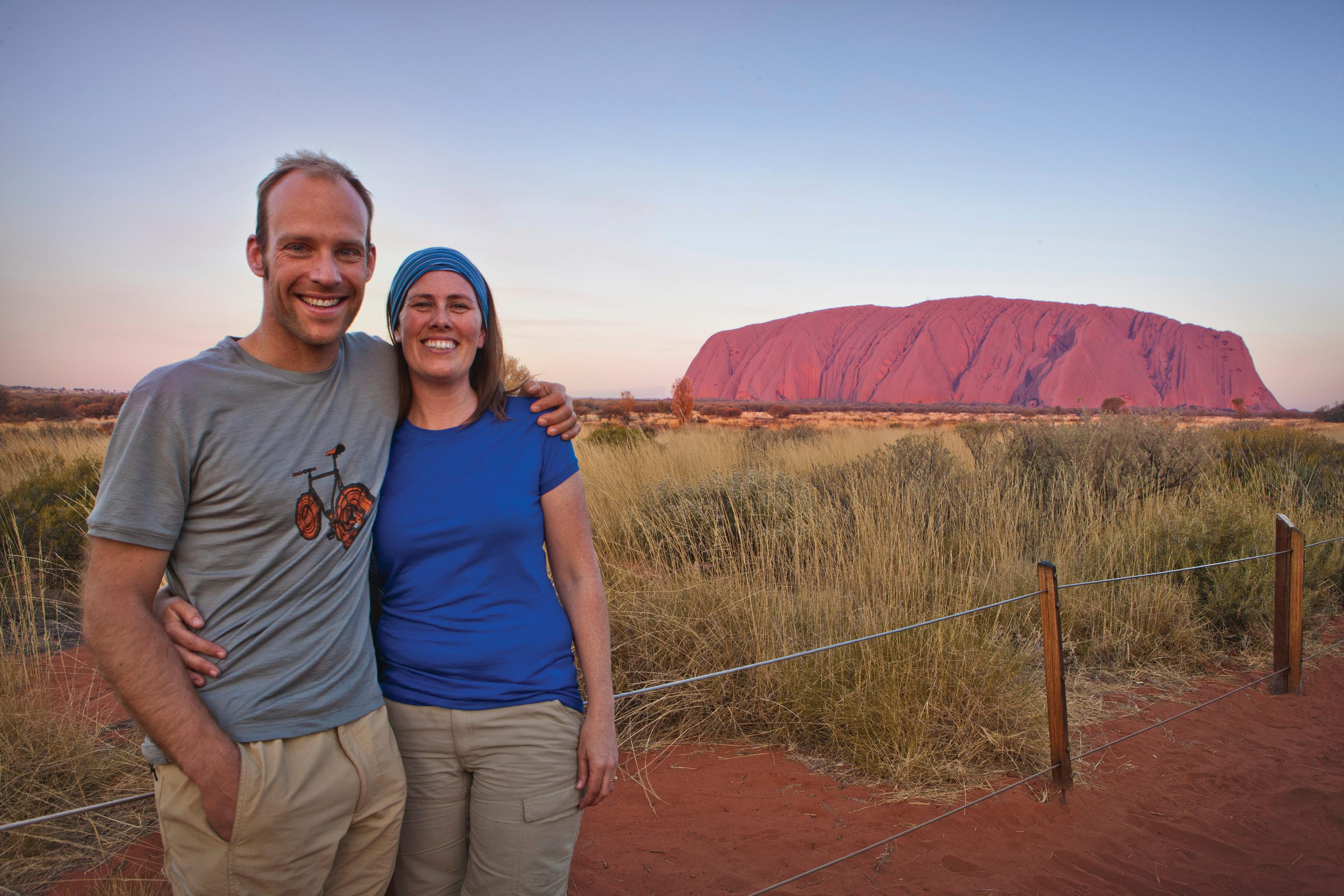 couple in front of Uluru