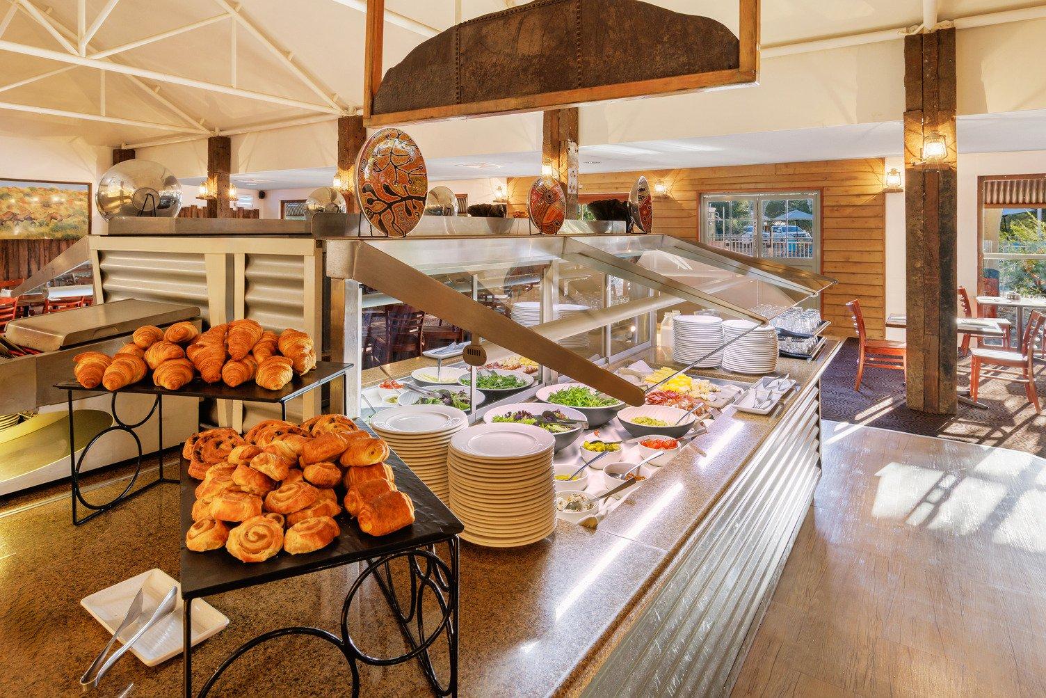 The breakfast buffet station with pastries, fruits and cereals in the middle of Bough House Restaurant