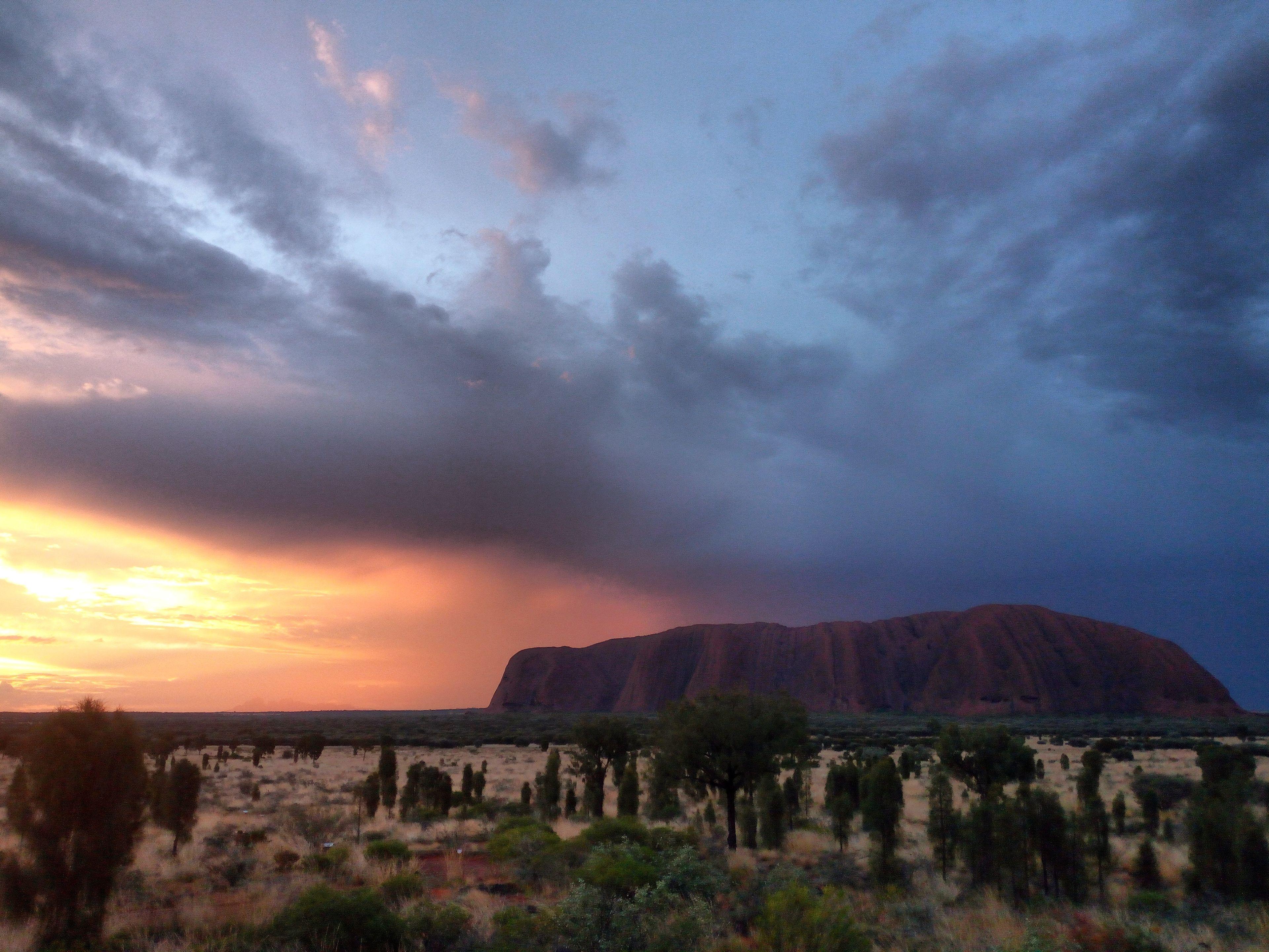 Sun setting behind Ayers Rock