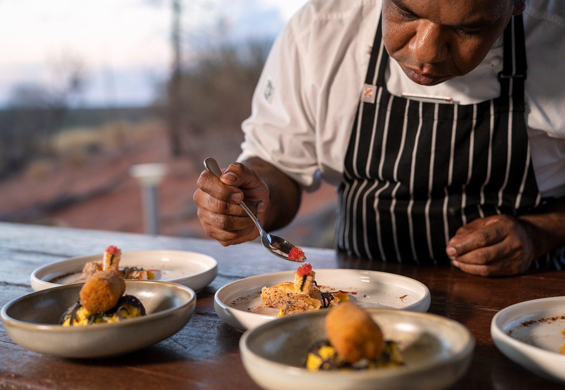 Tali Wiru chef preparing entrees