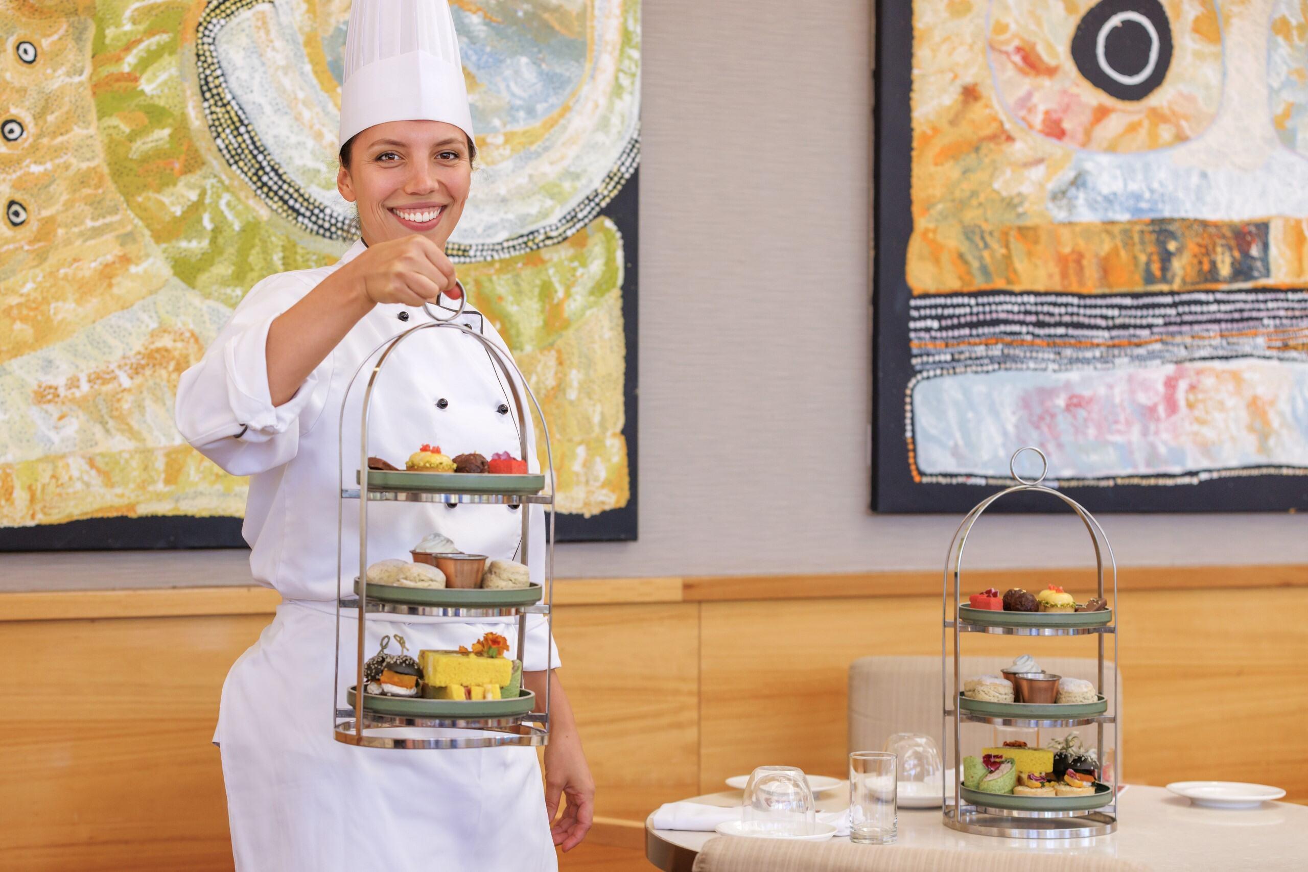 Chef Grace holding the tray of canapes at Australian Native High Tea