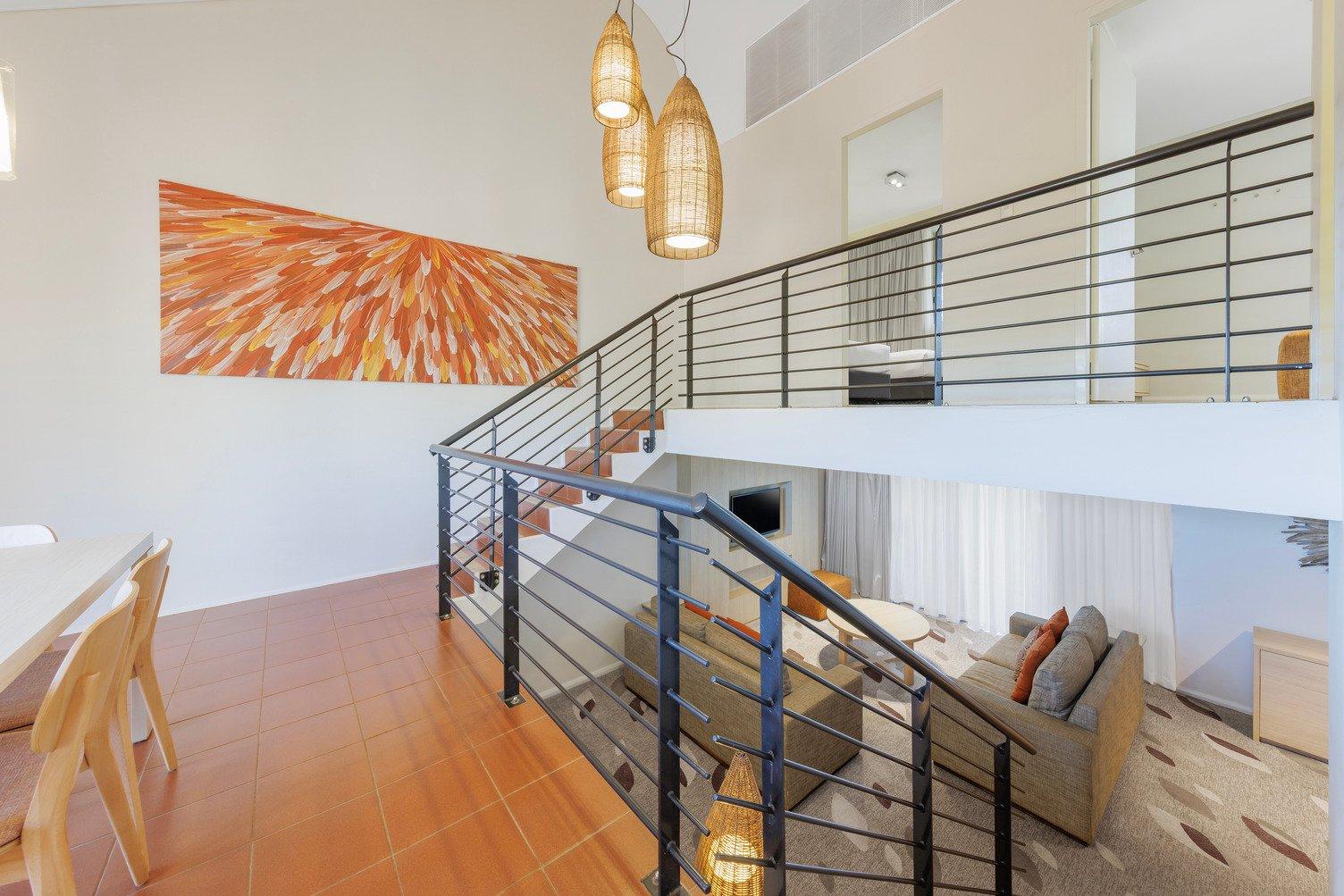 Dining area looking down the stairs to the loungeroom and up the stairs to the bedrooms