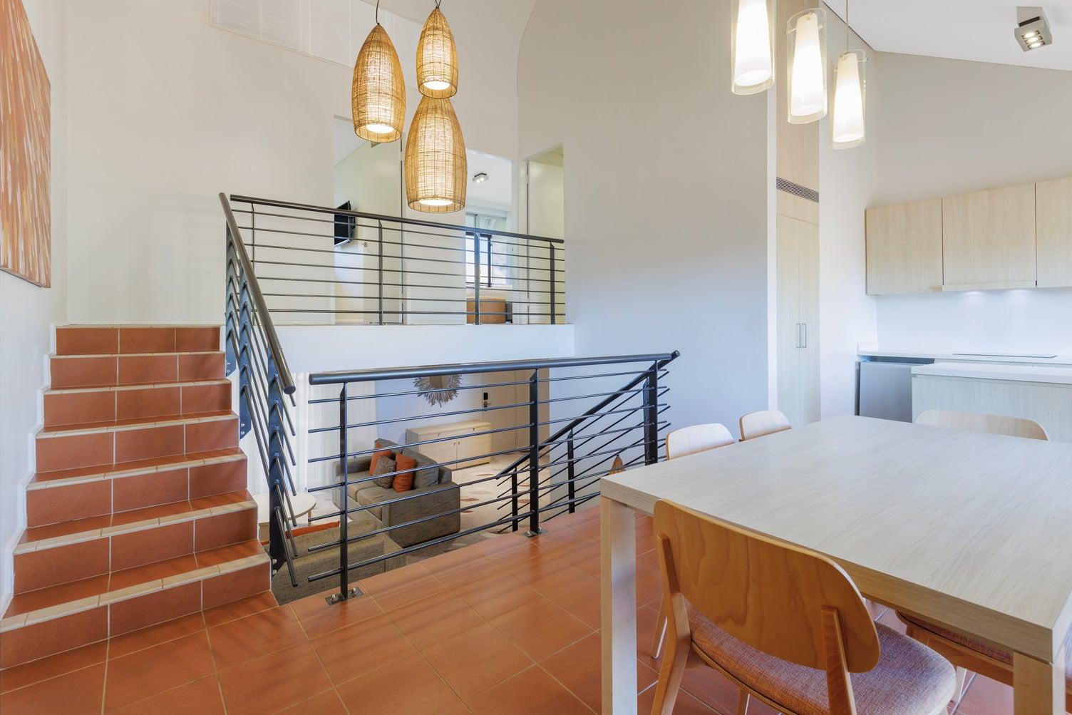 Dining and kitchen area looking down the stairs to the lounge and up towards the bedrooms