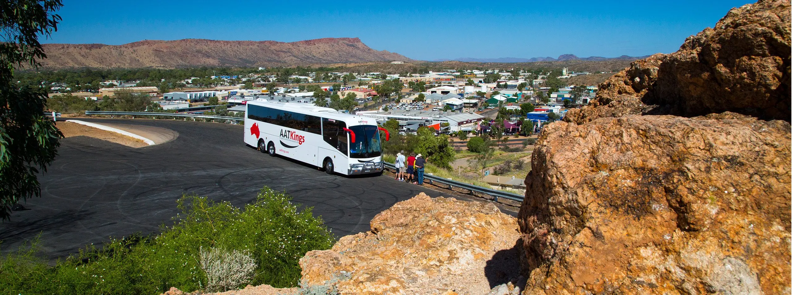 AAT Kings Coach overlooking Alice springs on a hill