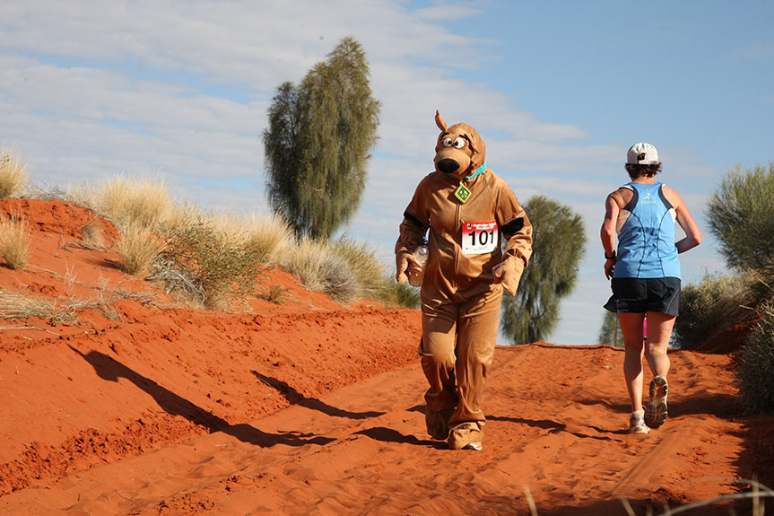 A person runs in the Australia Outback Marathon dressed as Scooby Doo