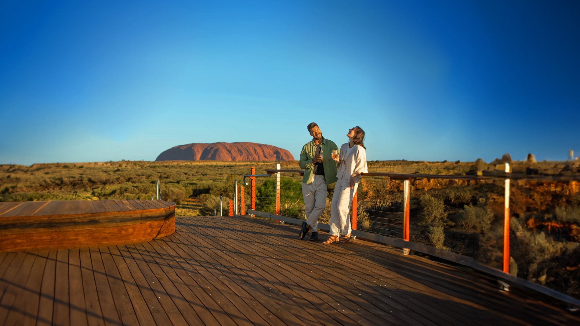 Couple in front of Uluru laughing