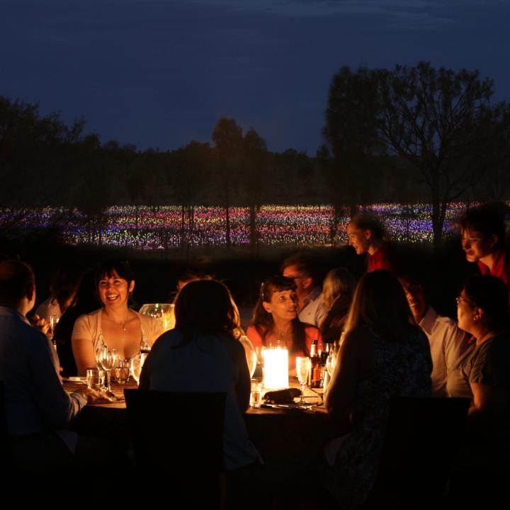 Dinner by candlelight in front of Field of Light at Ayers Rock