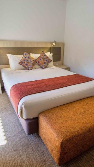 Hotel bedroom with queen bed