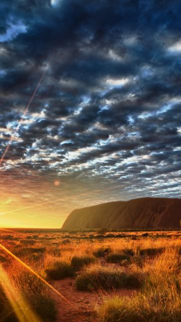 sunrise behind Ayers Rock