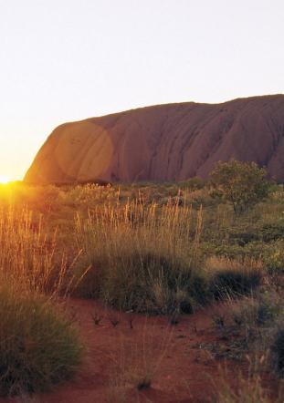 sunrise behind Uluru